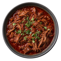 Illustrative serving of pulled beef in a dark ceramic bowl