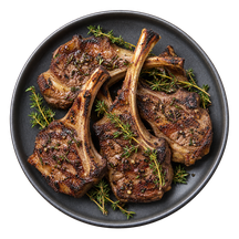 Illustrative serving of browned lamb chops with herbs