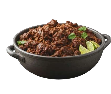 Barbacoa beef in a black serving bowl with lime and herbs.