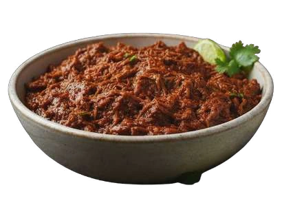 Pulled Beef in a shallow bowl with lime and coriander.