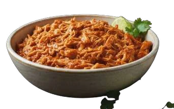 Pulled Chicken in a bowl with lime and coriander.