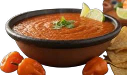 Habanero Salsa in a dark-rimmed bowl with habanero chillies.