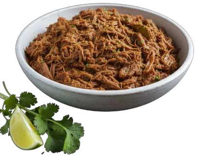 Pulled Lamb in a white bowl with lime and herbs.