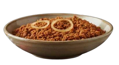 Plant-based Minced Meatless in a shallow bowl with onion rings.