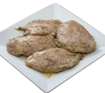 Smoked Chicken breast portions on a white plate.